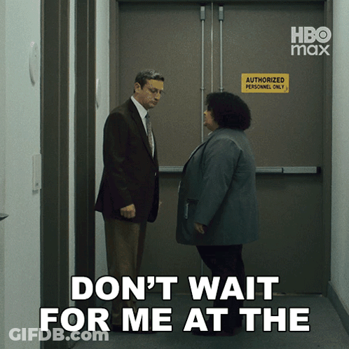 A Man And A Woman Are Standing In Front Of An Authorized Personnel Only Door GIF