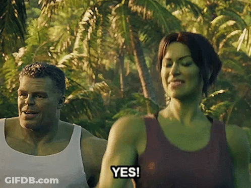 A Man And A Woman Are Standing In The Jungle And The Woman Is Saying Yes . GIF