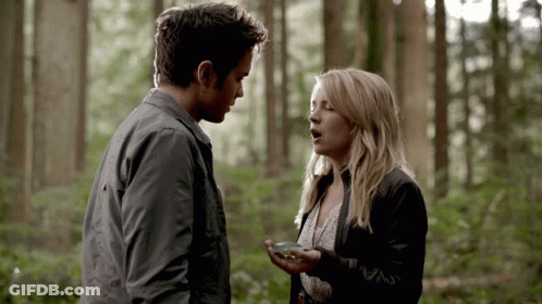 Man And Woman Talking In Woods GIF