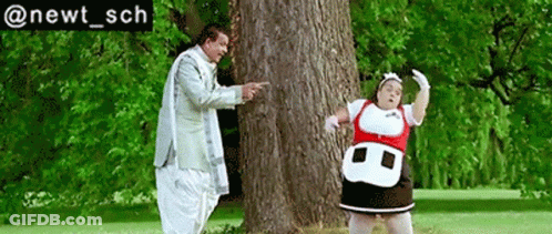 A Man And A Woman Are Standing Next To A Tree With The Hashtag @Newt_sch Below Them GIF