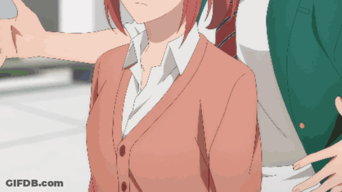 A Man And A Woman Are Standing Next To Each Other GIF