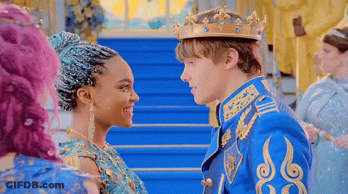 A Man And A Woman Are Standing Next To Each Other And Looking At Each Other In A Castle . GIF