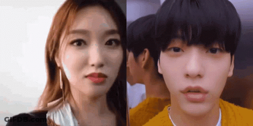 A Man And A Woman Are Standing Next To Each Other And Looking At The Camera GIF
