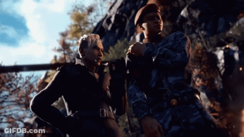A Man And A Woman Are Standing Next To Each Other And Talking . GIF