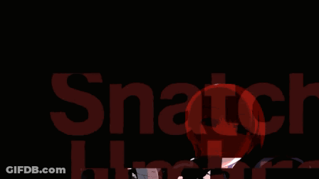A Man And A Woman Are Standing Next To Each Other And The Man Is Holding A Red Object GIF