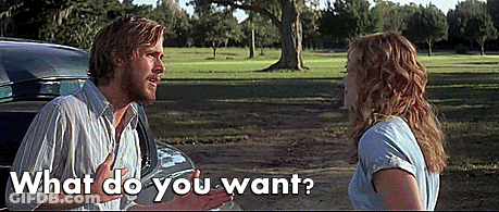 A Man And A Woman Are Standing Next To Each Other And The Man Is Pointing At The Woman And Asking What Do You Want GIF
