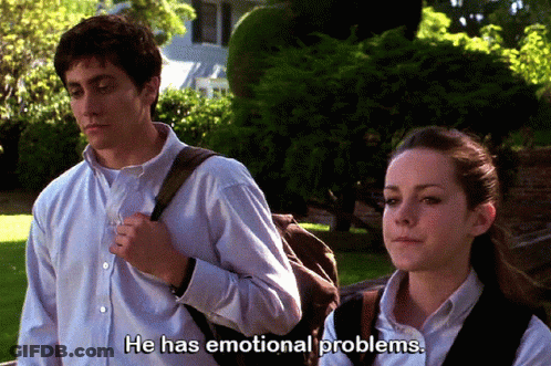 A Man And A Woman Are Standing Next To Each Other And The Man Is Saying He Has Emotional Problems GIF