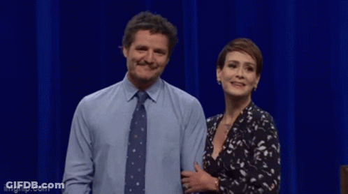 A Man And A Woman Are Standing Next To Each Other And The Man Is Saying No Crumbs Left GIF