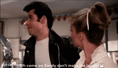 A Man And A Woman Are Standing Next To Each Other And The Man Is Saying Oh Come On Sandy Don 'T Make Me Laugh GIF