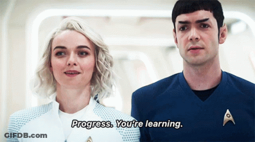 A Man And A Woman Are Standing Next To Each Other And The Man Is Saying Progress You 'Re Learning GIF