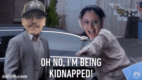 A Man And A Woman Are Standing Next To Each Other And The Man Is Wearing A Hat That Says Brooklyn 99 GIF