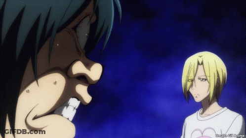 A Man And A Woman Are Standing Next To Each Other And The Man Is Wearing A White Shirt With A Heart On It .. GIF
