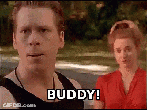 A Man And A Woman Are Standing Next To Each Other And The Man Says Buddy . GIF