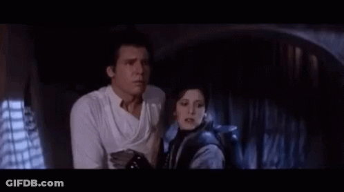 A Man And A Woman Are Standing Next To Each Other And The Man Says " I Know That Laugh " GIF