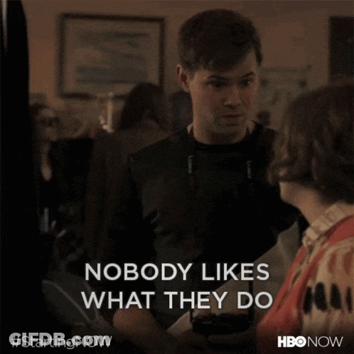 A Man And A Woman Are Standing Next To Each Other And The Man Says Nobody Likes What They Do GIF