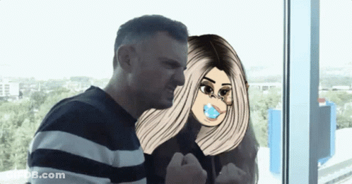 A Man And A Woman Are Standing Next To Each Other And The Woman Has A Pacifier In Her Mouth GIF