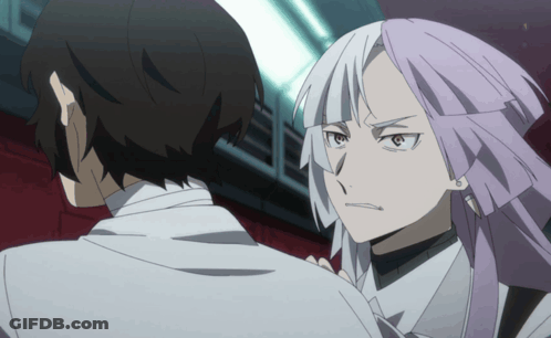 A Man And A Woman Are Standing Next To Each Other And The Woman Has Purple Hair GIF