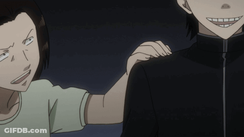 A Man And A Woman Are Standing Next To Each Other And The Woman Is Holding The Man 'S Arm GIF