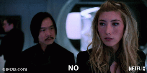 A Man And A Woman Are Standing Next To Each Other And The Woman Is Saying " No " GIF