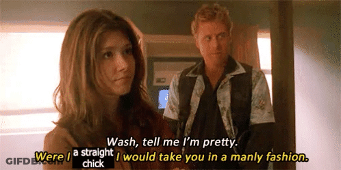 A Man And A Woman Are Standing Next To Each Other And The Woman Is Talking To The Man About Her Appearance . GIF