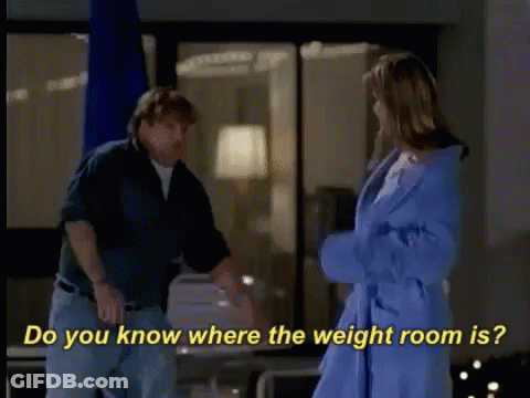 A Man And A Woman Are Standing Next To Each Other And The Woman Is Wearing A Blue Robe GIF
