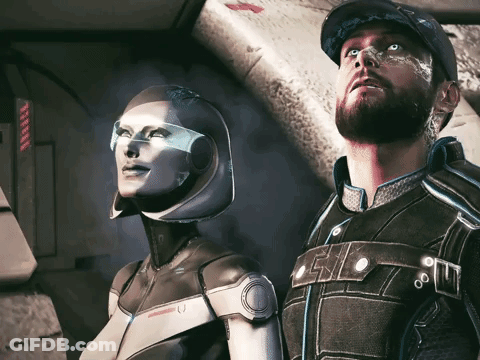 A Man And A Woman Are Standing Next To Each Other And The Woman Is Wearing A Helmet That Has The Letter U On It GIF