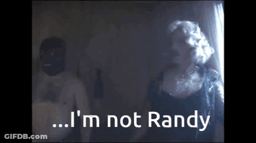 A Man And A Woman Are Standing Next To Each Other And The Woman Says I 'M Not Randy GIF