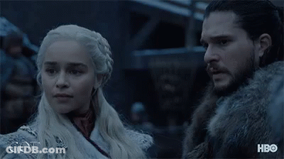 A Man And A Woman Are Standing Next To Each Other And The Word Got Is On The Bottom Right GIF