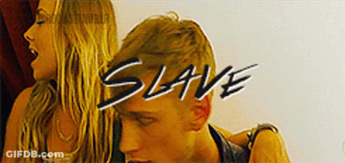 A Man And A Woman Are Standing Next To Each Other And The Word Slave Is On The Bottom GIF