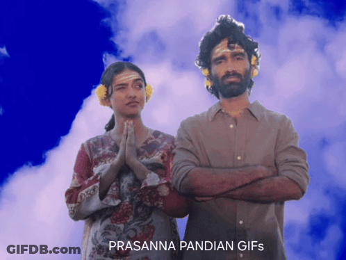 A Man And A Woman Are Standing Next To Each Other And The Words Prasanna Pandian Gifs Are On The Bottom GIF