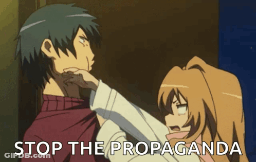 A Man And A Woman Are Standing Next To Each Other And The Words Stop The Propaganda Are Visible GIF