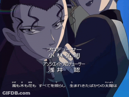 A Man And A Woman Are Standing Next To Each Other And Their Names Are Written In A Foreign Language GIF