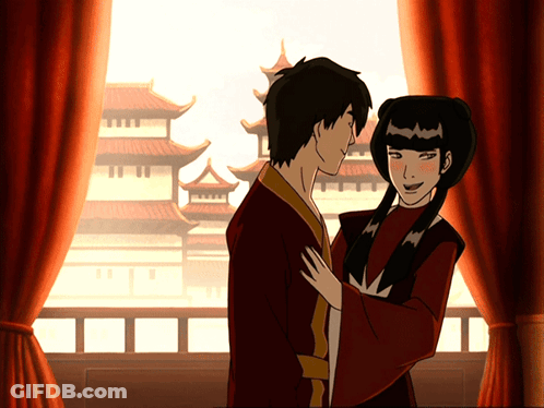 A Man And A Woman Are Standing Next To Each Other GIF