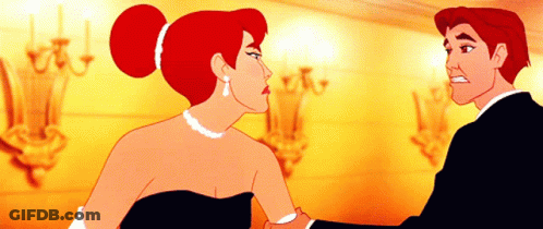 A Man And A Woman Are Standing Next To Each Other GIF