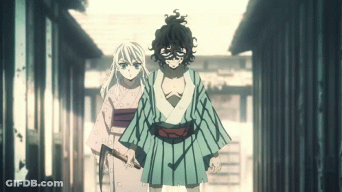 A Man And A Woman Are Standing Next To Each Other Holding Swords GIF