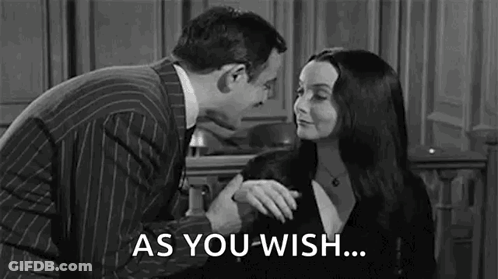 A Man And A Woman Are Standing Next To Each Other In A Black And White Photo . GIF