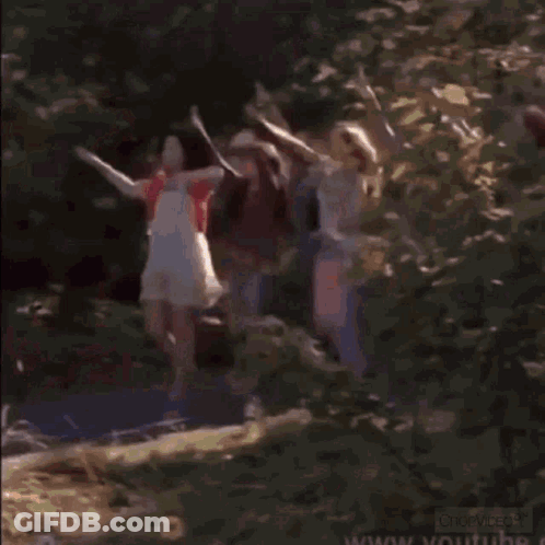 A Man And A Woman Are Standing Next To Each Other In A Blurry Photo . GIF