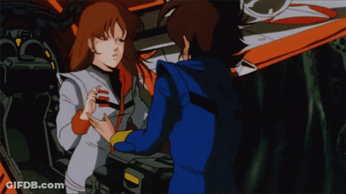 A Man And A Woman Are Standing Next To Each Other In A Cartoon GIF