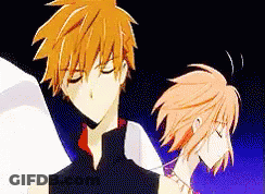 A Man And A Woman Are Standing Next To Each Other In A Cartoon . GIF