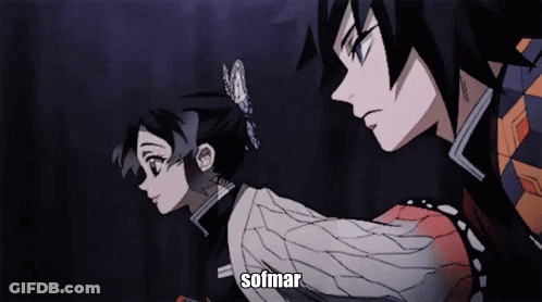 A Man And A Woman Are Standing Next To Each Other In A Dark Room And The Word Sofmar Is On The Bottom Of The Screen GIF