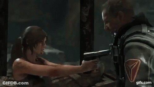 A Man And A Woman Are Standing Next To Each Other In A Dark Room . GIF