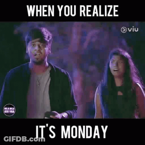 A Man And A Woman Are Standing Next To Each Other In A Dark Room With A Purple Background . GIF