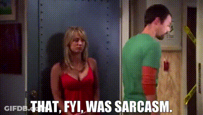 A Man And A Woman Are Standing Next To Each Other In A Doorway . The Woman Is Wearing A Red Dress . GIF