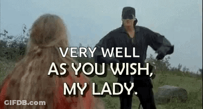 A Man And A Woman Are Standing Next To Each Other In A Field . GIF