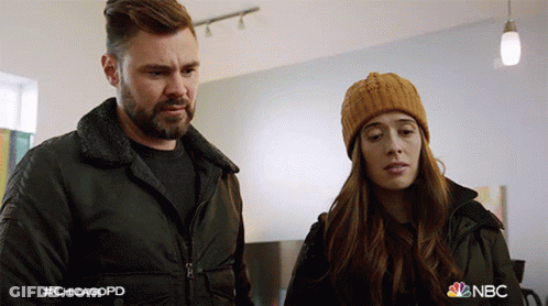 Man And Woman Standing Next To Each Other GIF