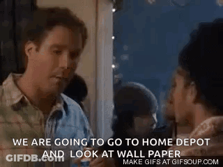 A Man And A Woman Are Standing Next To Each Other In A Room And Talking . GIF