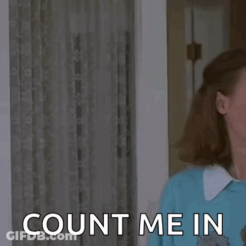 A Man And A Woman Are Standing Next To Each Other In A Room And The Woman Is Asking The Man To Count Her In . GIF