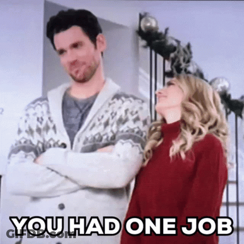 A Man And A Woman Are Standing Next To Each Other In A Room . GIF