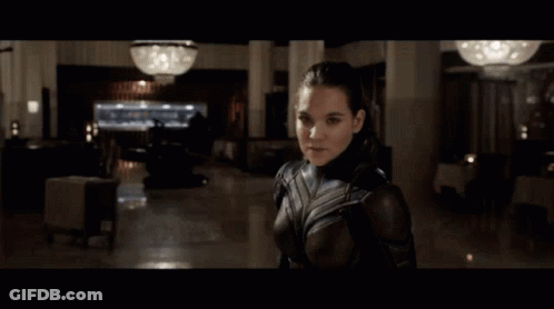 Man And Woman Standing In Room GIF
