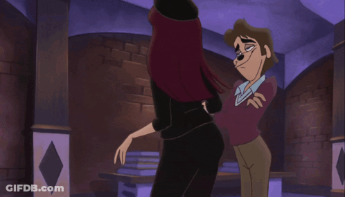 A Man And A Woman Are Standing Next To Each Other In A Room GIF